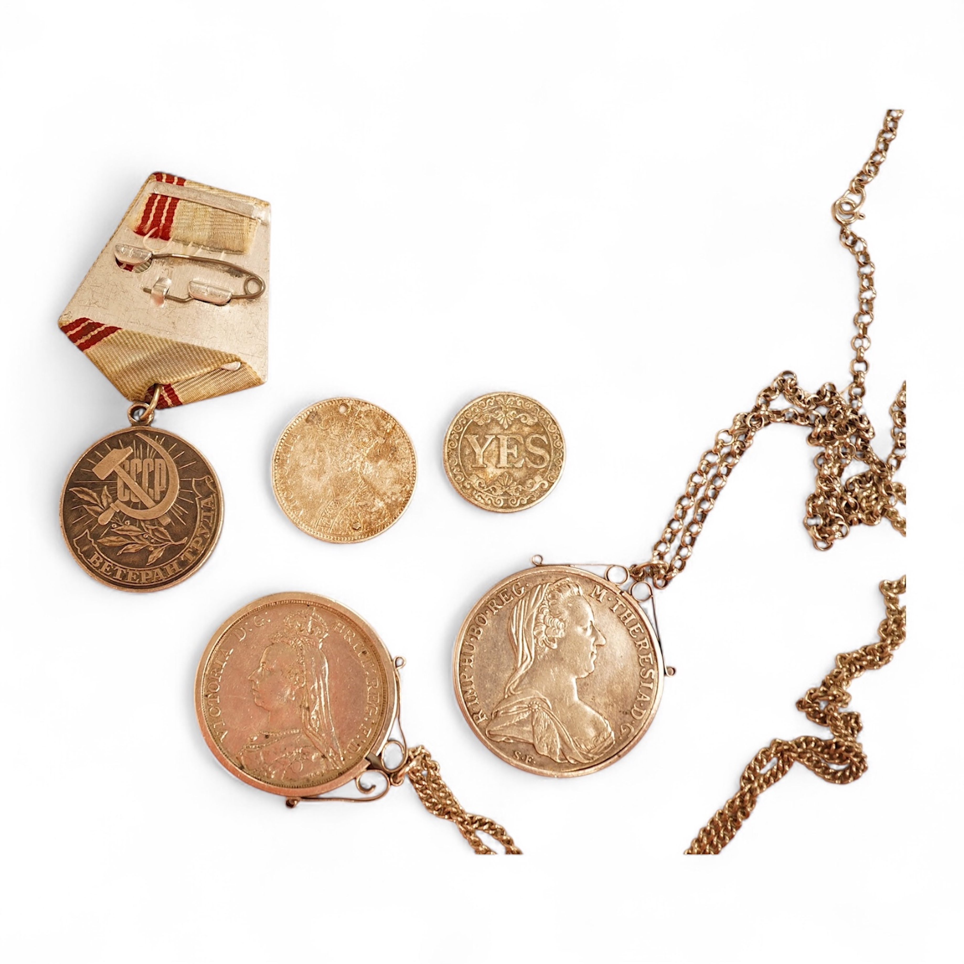 World coins, Victoria, 1891 crown, mounted with chain, Austria, Maria Theresa Thaler, mounted, CCCP medal award, a pierced one rupee India eighteen ninety and a novelty yes no fantasy coin.